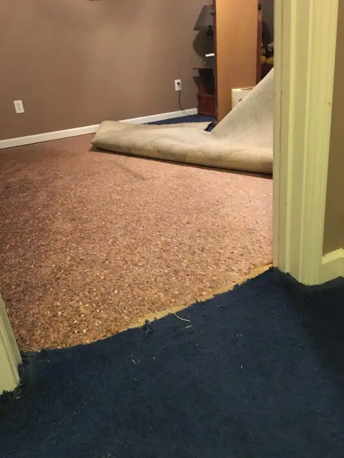 Carpet pad removal revealing water damage during Water Mitigation Services in East San Gabriel